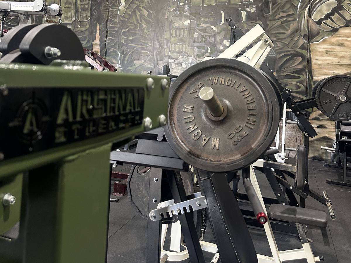 Close-up of a loaded plate machine in the Wellness Hub